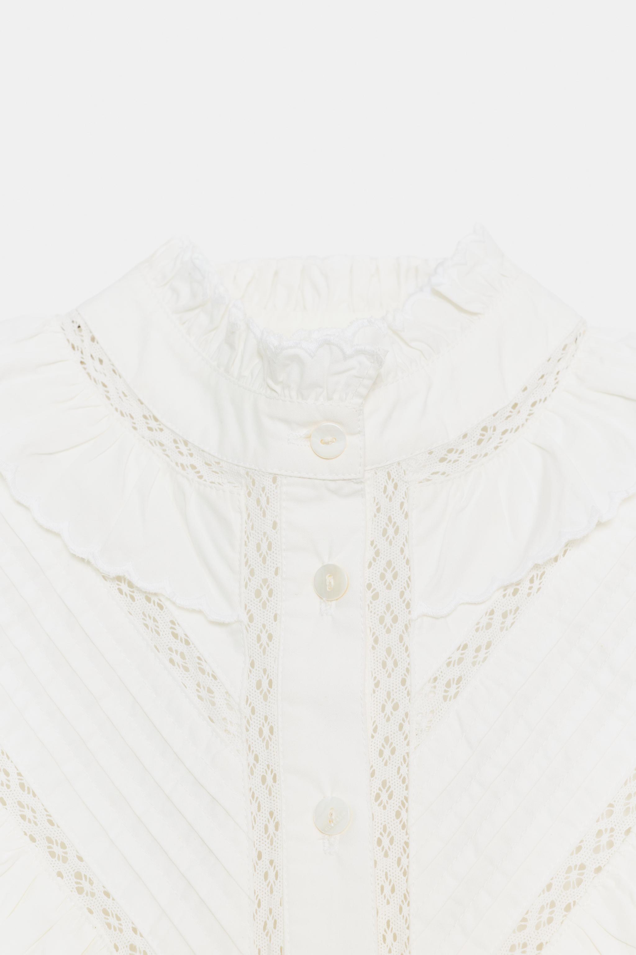BLOUSE ROMANTIQUE À VOLANTS